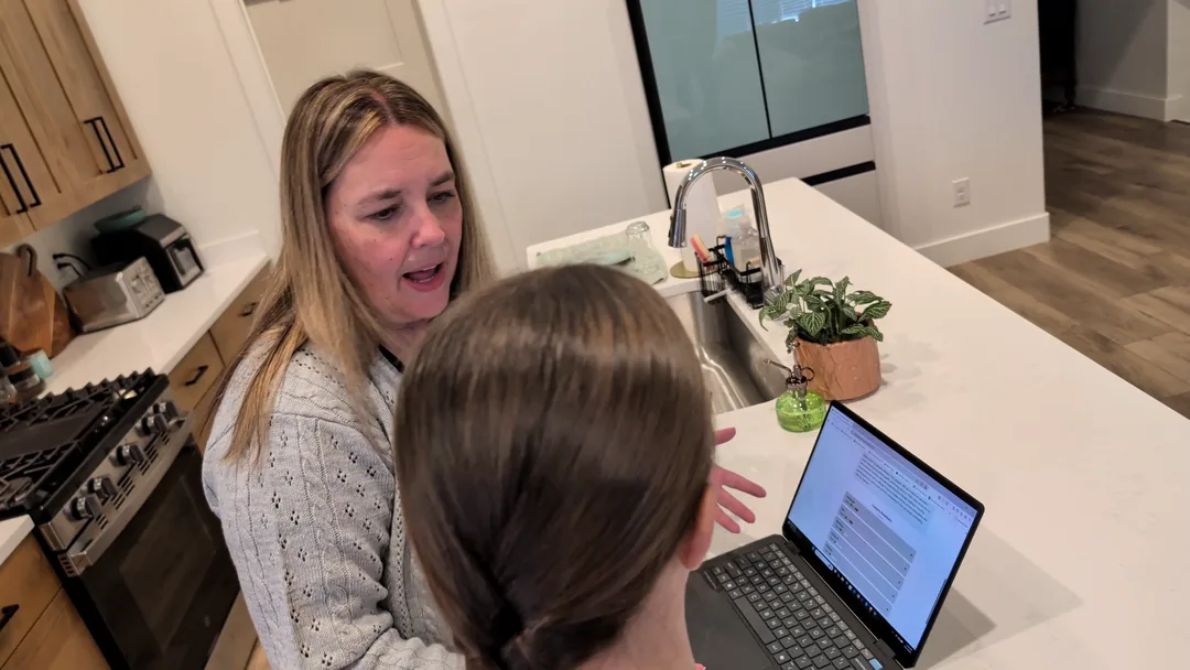 A mother and daughter using Bookrata's filtering on a laptop